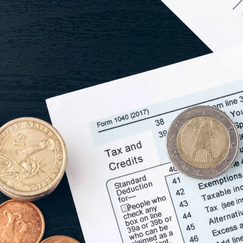 the-close-up-of-accounting-documents-with-money-co-2023-11-27-05-07-45-utc (1)